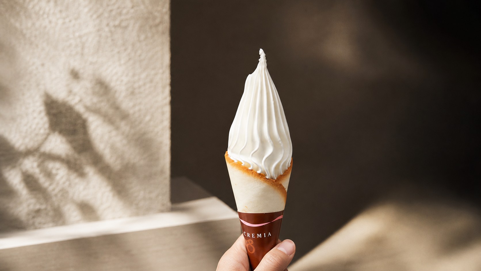 Cremia premium Japanese soft-serve ice cream in a langue de chat cookie cone
